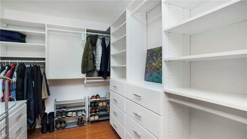 Spacious closet with wood finished floors