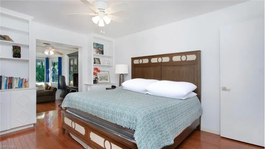 Bedroom featuring wood finished floors and a ceiling fan