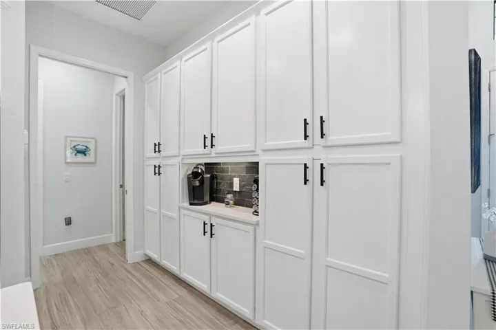 Pantry wall with coffee bar.