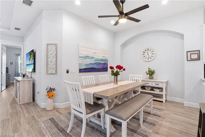 Dining room, adjacent to the kitchen island.