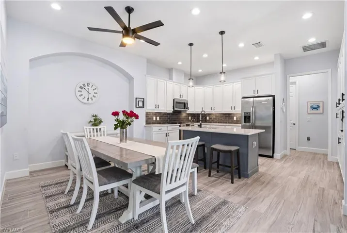 Dining, kitchen and living open to one another.