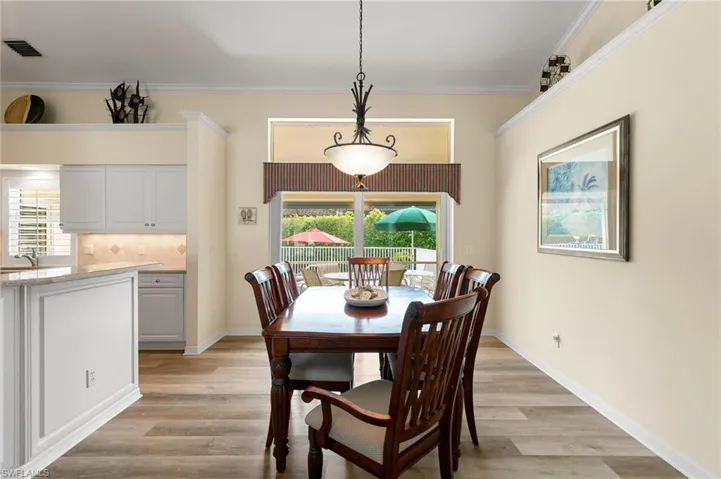 Dining space looking out to lanai and pool