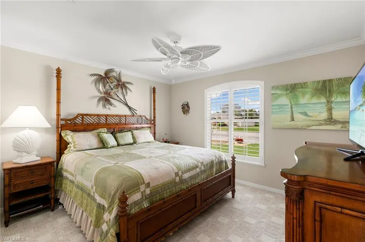 Second Bedroom featuring ceiling fan, and ornamental molding