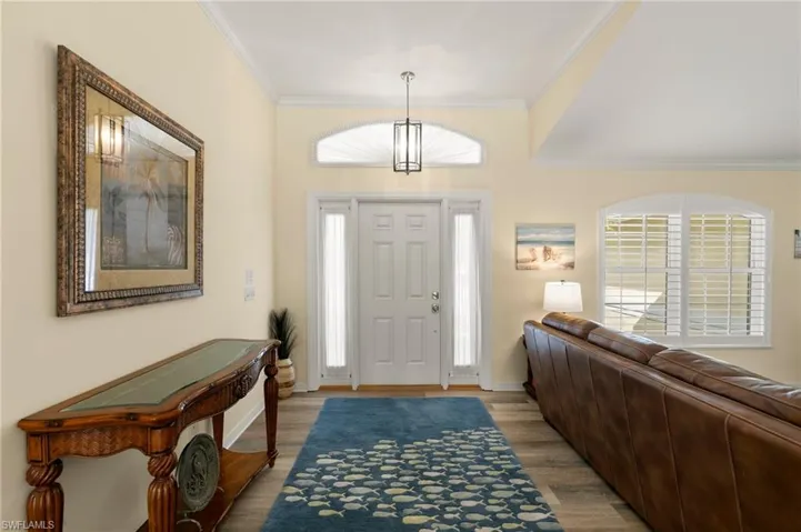 Foyer featuring crown molding