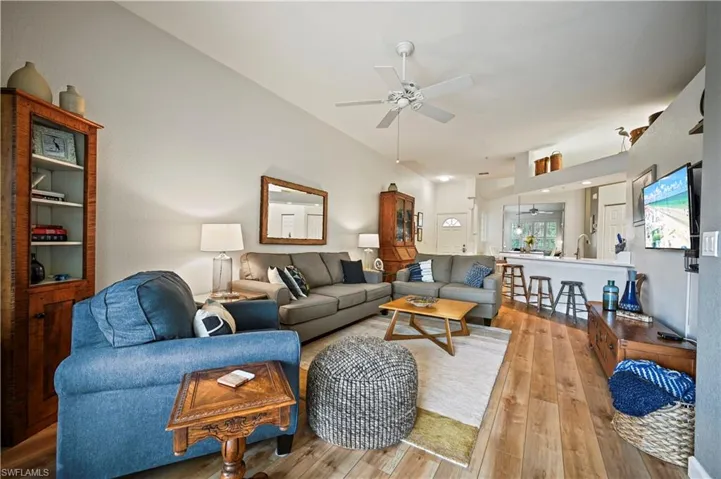Living room featuring ceiling fan and light wood-type flooring