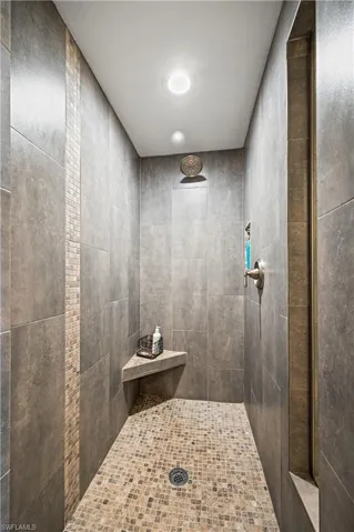 Bathroom featuring a tile shower