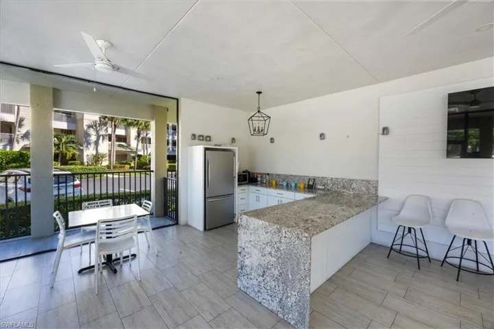 Community room by the pool and tennis courts