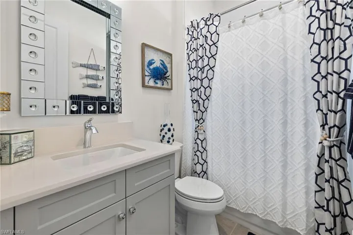 Bathroom with vanity and shower / tub combo