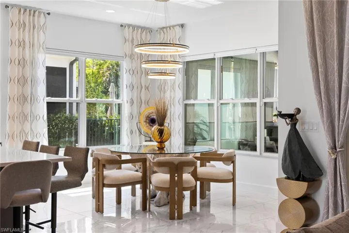 Dining room featuring baseboards and recessed lighting