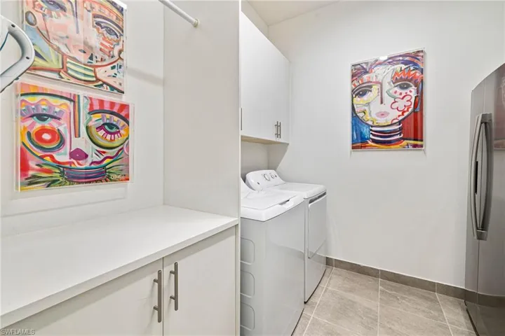 Laundry room with cabinet space and independent washer and dryer