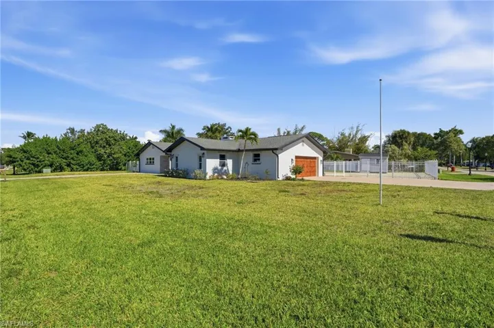 Ranch-style home with concrete driveway and a garage
