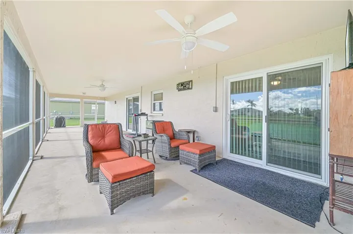 Sunroom / solarium featuring ceiling fan