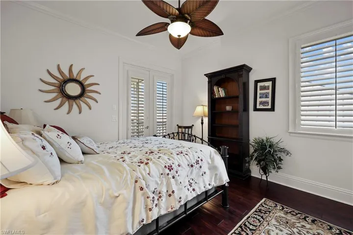Third floor Guest bedroom, French doors to balcony overlooking water