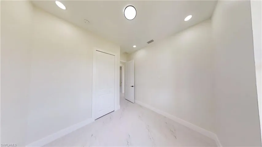 Bathroom with vanity, light marble finish flooring, a bath, and a shower