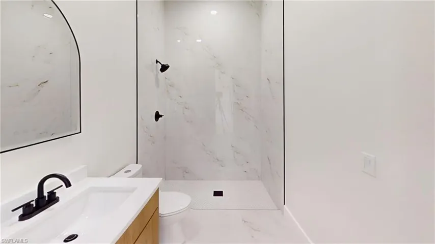 Spare room featuring recessed lighting and light marble finish flooring