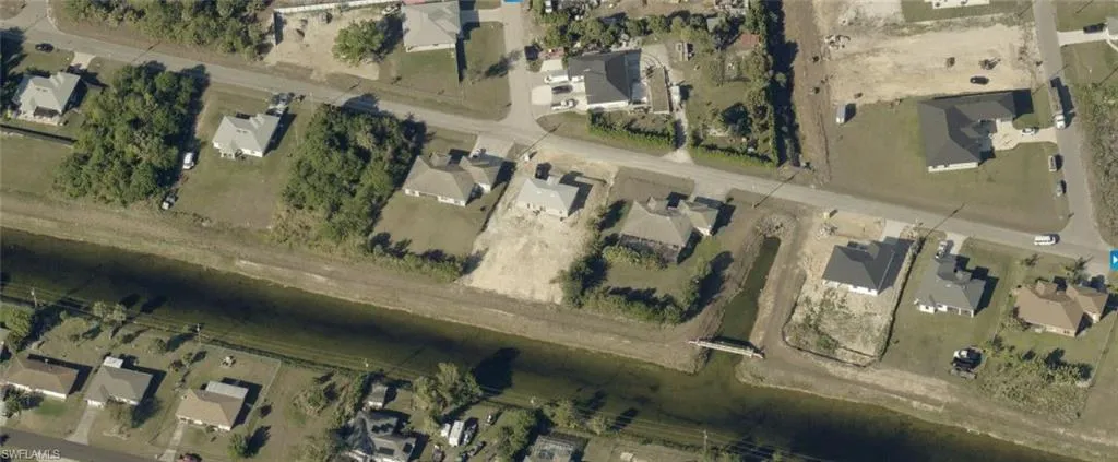 Aerial view of property's location featuring property parcel outlined