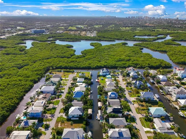 Aerial perspective of suburban area with a nearby body of water