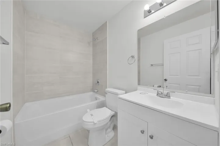 Full bathroom featuring vanity and shower / washtub combination