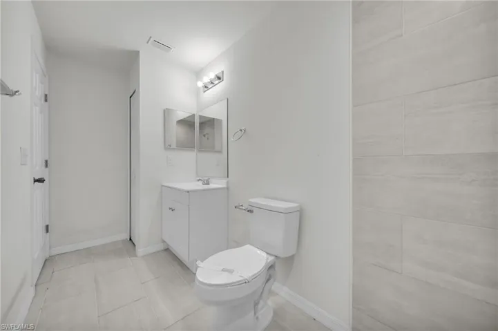 Bathroom featuring vanity and light tile patterned floors