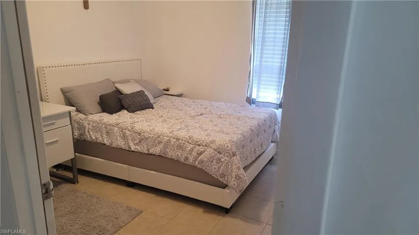 Bedroom featuring light tile patterned floors