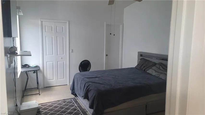 Bedroom featuring ceiling fan and light tile patterned floors
