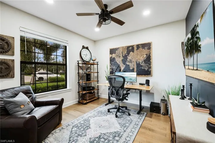 Bedroom 4 used as an office. Plantation shutters have been installed.