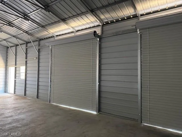 Garage featuring metal wall