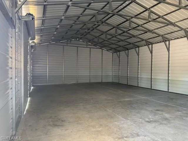 Garage featuring metal wall