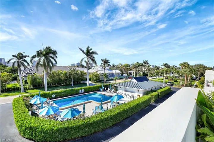 Community pool featuring a patio
