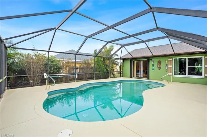 View of swimming pool with a lanai, a mountain view, and a patio
