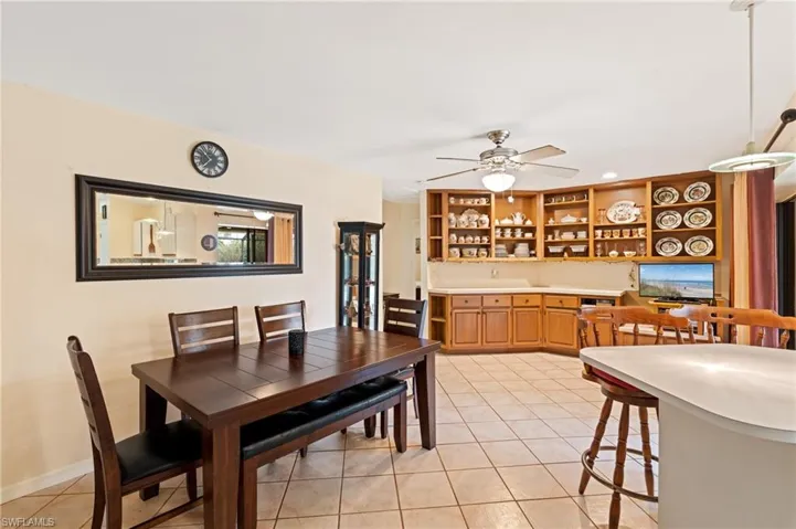 Dining room featuring ceiling fan and light tile patterned floors