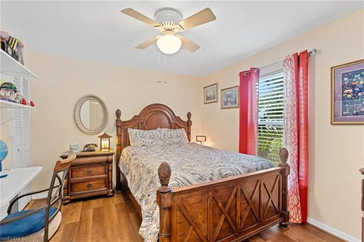 Bedroom featuring hardwood / wood-style flooring and ceiling fan