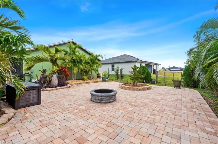 View of patio featuring a fire pit