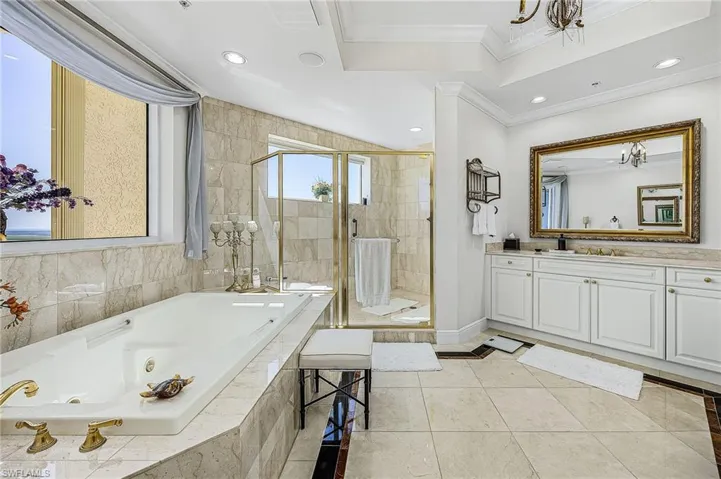Full bathroom with a whirlpool tub, vanity, recessed lighting, a stall shower, and light tile patterned flooring