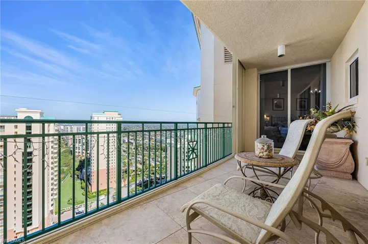 Balcony featuring a view of city