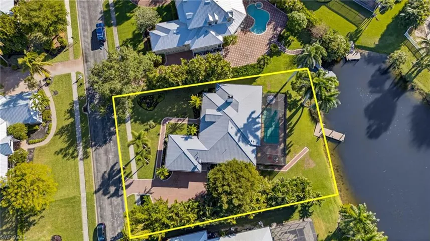 Aerial view of residential area with property boundaries highlighted