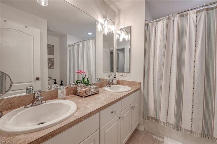 Guest bathroom features a double sink vanity
