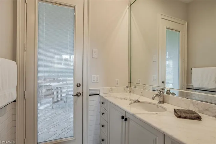Bathroom with vanity and a healthy amount of sunlight
