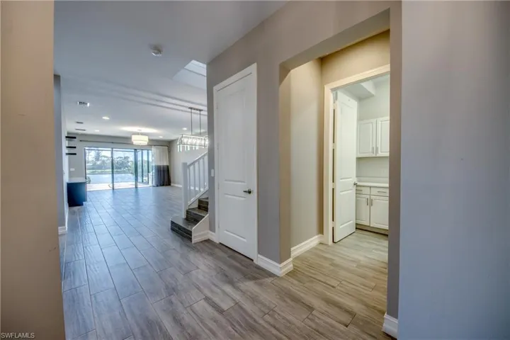 Laundry room to right, dining/living with lake view