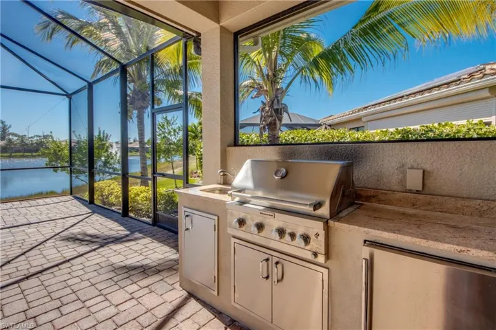 Outdoor kitchen grill and refrigerator
