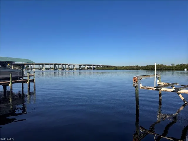 Dock area featuring a water view