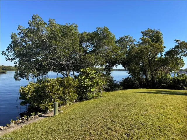 View of yard with a water view