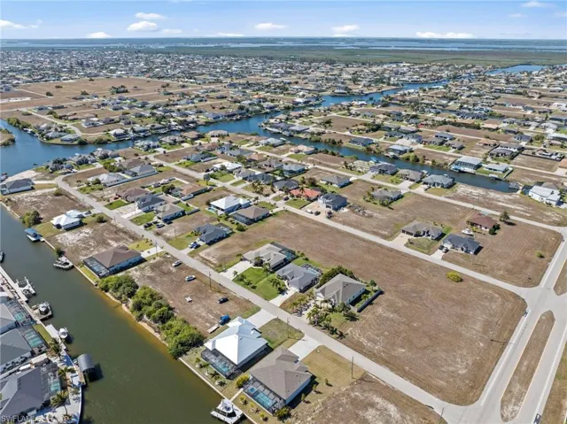 View of property location with nearby suburban area and a large body of water