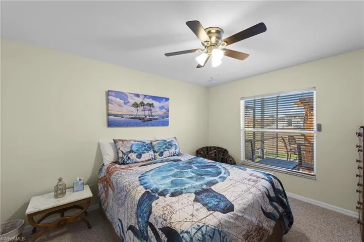 Bedroom featuring carpet and ceiling fan
