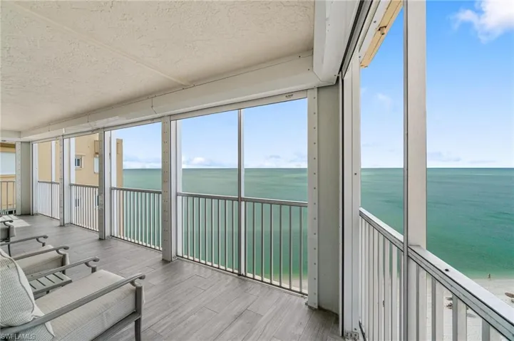 Unfurnished sunroom with a water view and healthy amount of natural light
