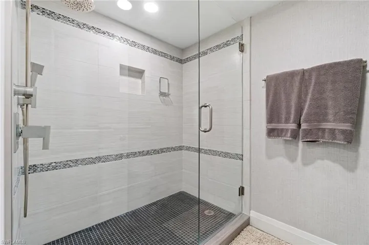Full bath with a stall shower and recessed lighting