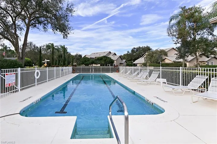 Community pool featuring a patio