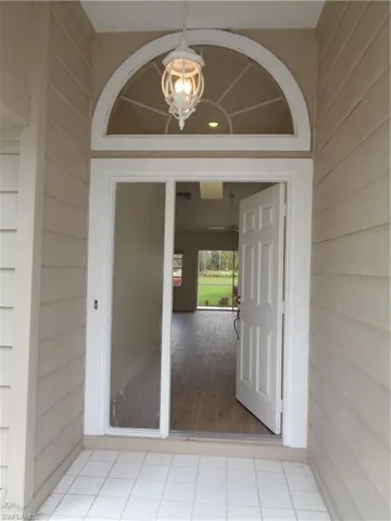 Property entrance featuring a patio
