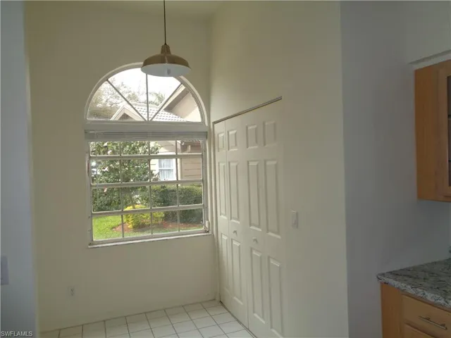 Unfurnished dining area with light tile patterned flooring