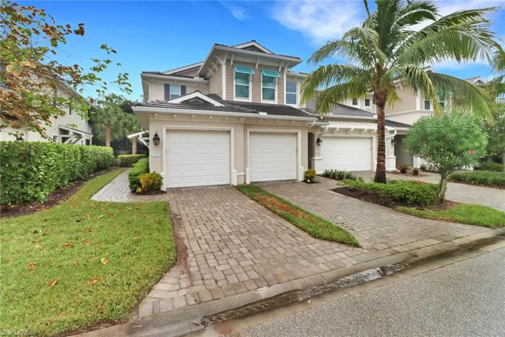 View of front of home with a garage, (door furthest to left)